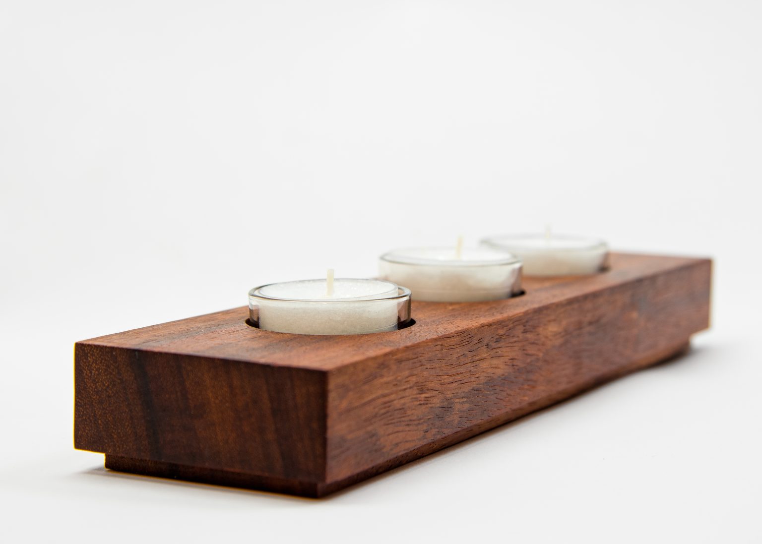 Bubinga candelabra holding three tealight candles