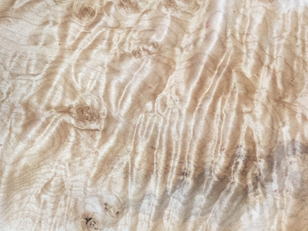 Curly maple board with shimmering tiger-stripe figure