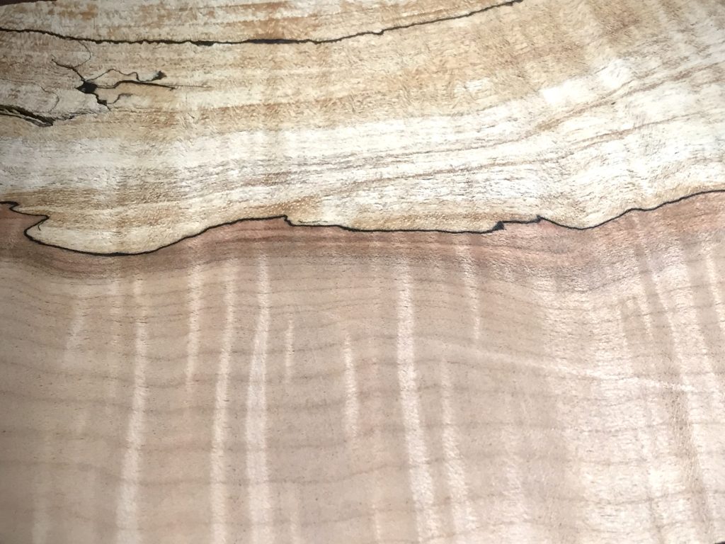 Spalted maple board with dark fungal lines running through the grain