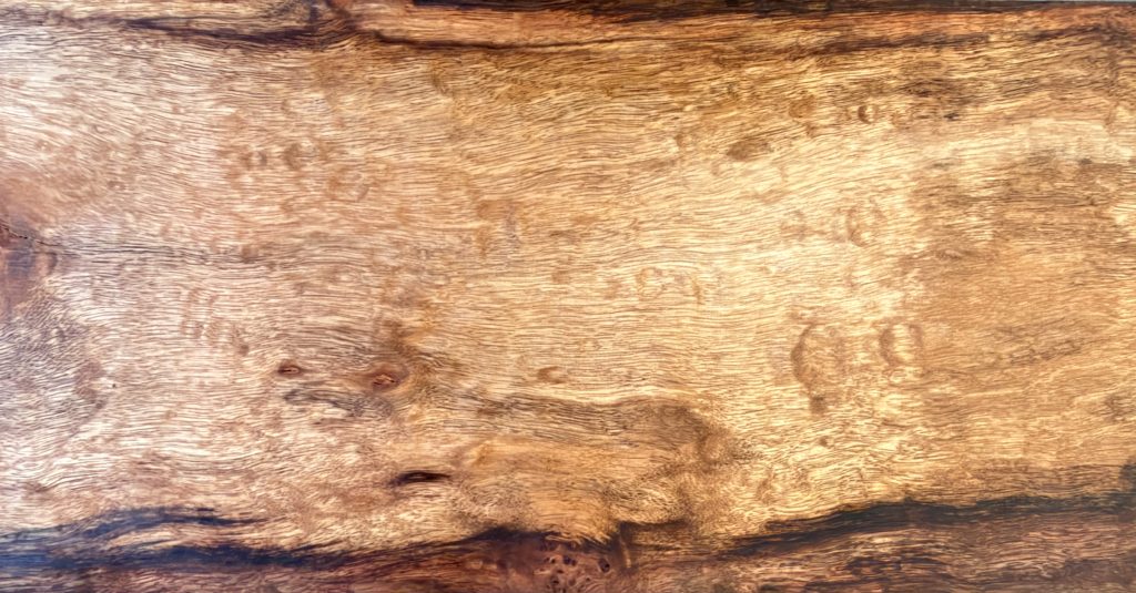 Caribbean birdseye rosewood with swirling eyes in fiery orange and red-brown