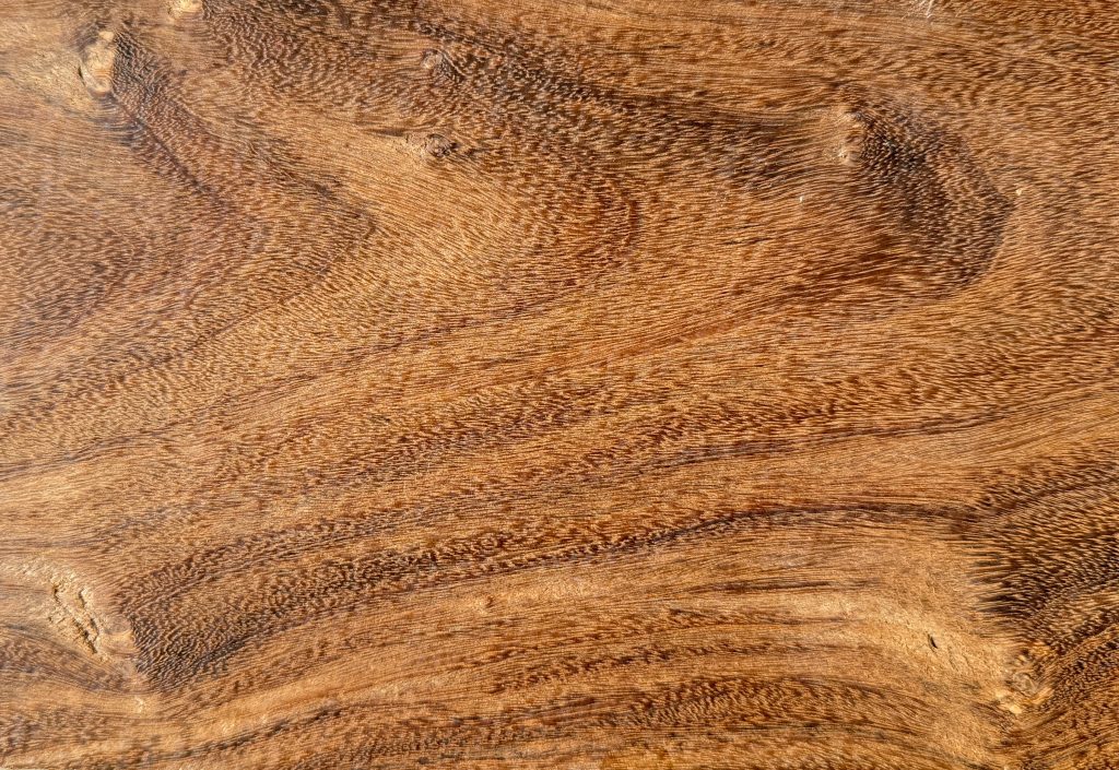 Coffee wood board with warm brown, swirling grain