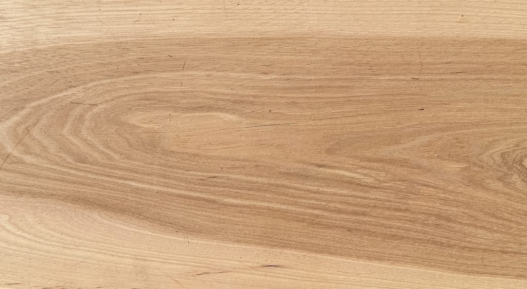 Hickory board with pale cream and tan grain