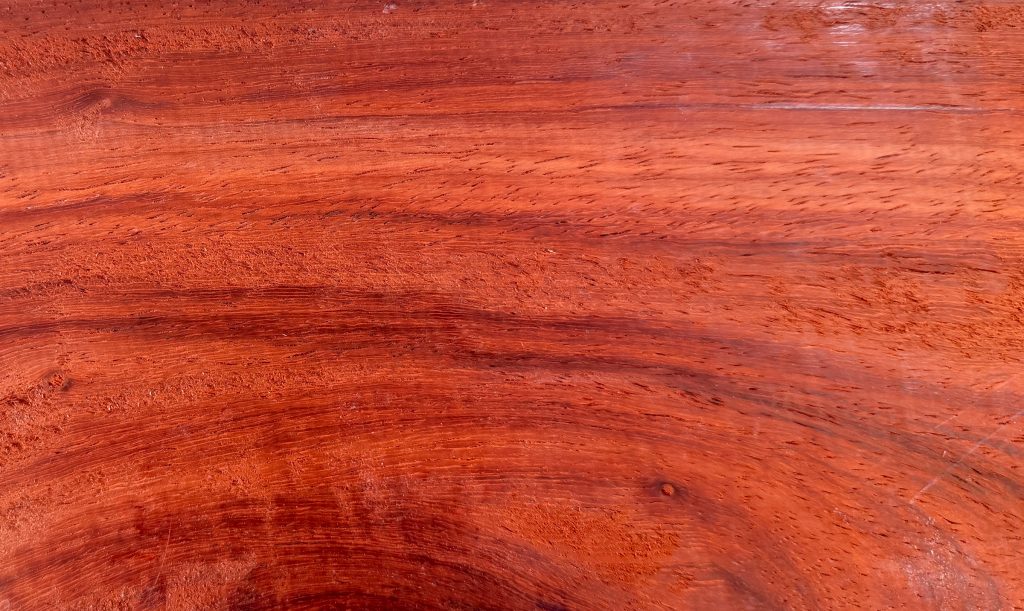 Padauk board with vivid reddish-orange heartwood