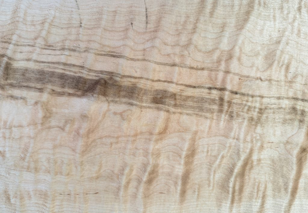 Quilted maple with rolling, three-dimensional figure