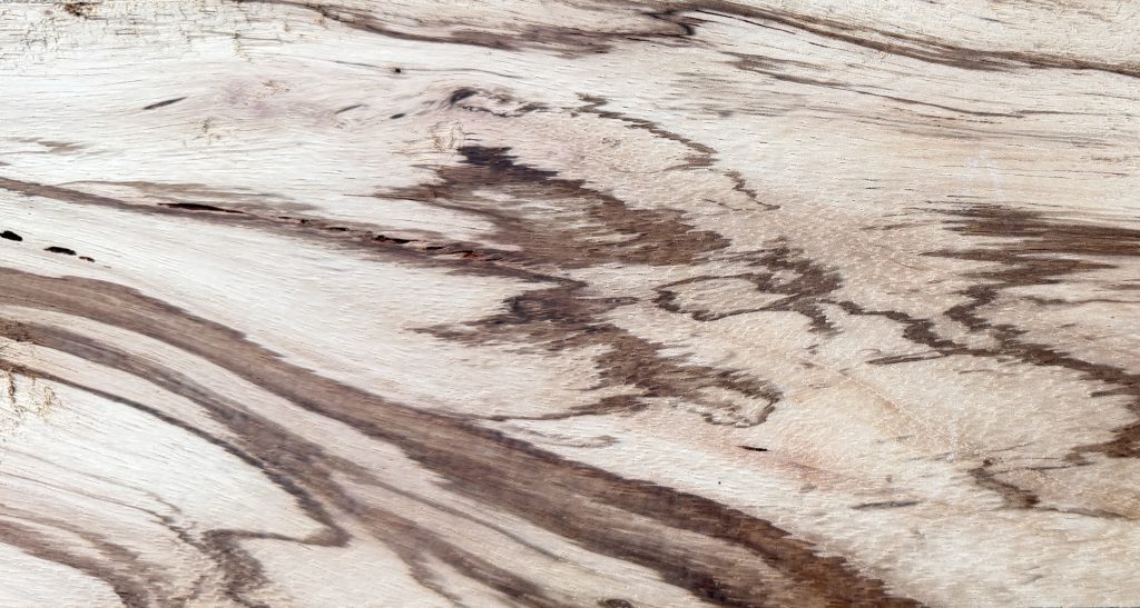 Zebrawood board showing sweeping stripes and pale cream ground